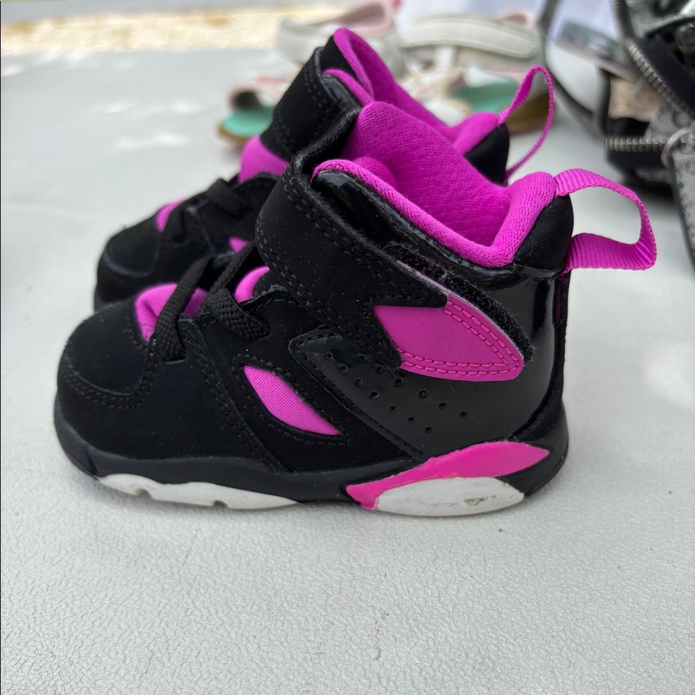 Pink and black Nike Jordan’s